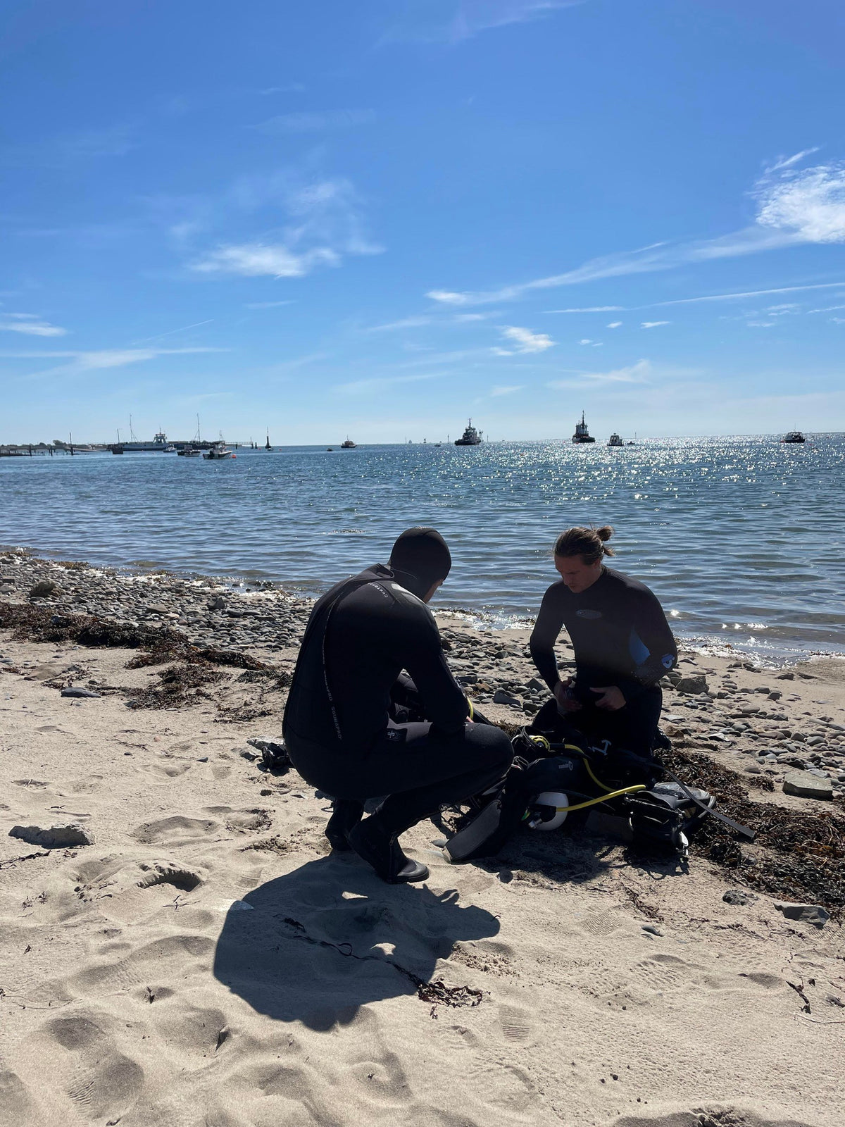 Dain and Zach preparing diving equipment at Greencastle