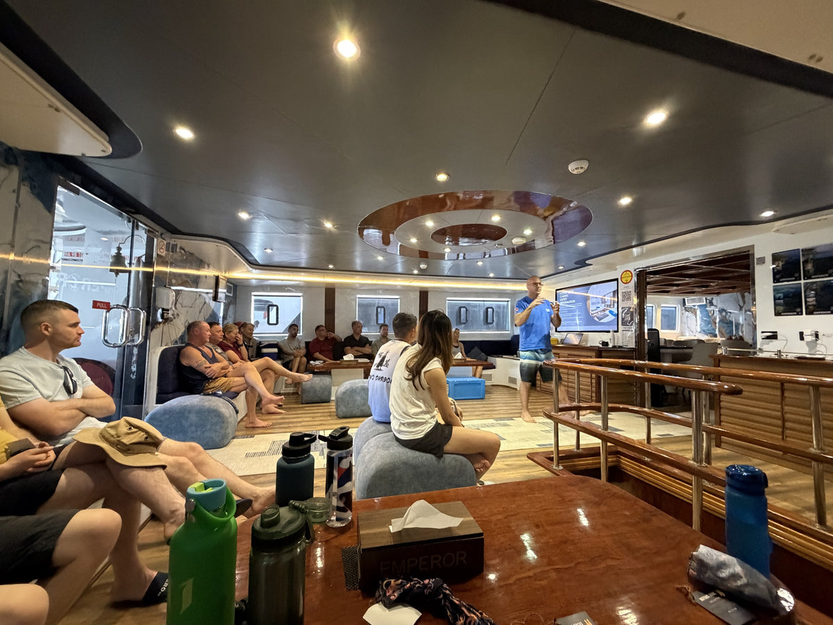 Our group listening to a dive briefing aboard Emperor Superior